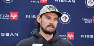 Hellebuyck Suspension: Jets Goalie’s Ban Ends Oct. 23 Connor Hellebuyck speaks to media at a Winnipeg Jets press conference