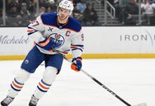 McDavid Assist Streak: Oilers Star Sets NHL Record at 13 Games Connor McDavid Edmonton Oilers captain skating during game, assist streak record