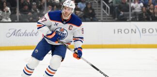 McDavid Assist Streak: Oilers Star Sets NHL Record at 13 Games Connor McDavid Edmonton Oilers captain skating during game, assist streak record