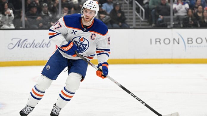 Connor McDavid Oilers assist streak record Connor McDavid Edmonton Oilers captain skating during game, assist streak record
