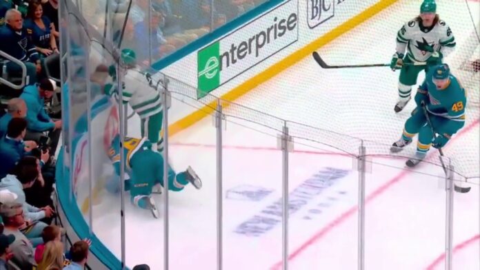Dillon Dube injury Blues Sharks Dillon Dube down on the ice after collision with Will Smith, Blues vs Sharks