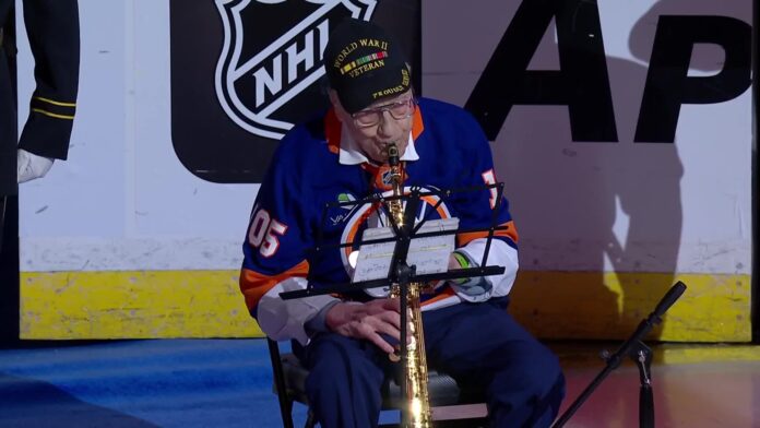Dominick Critelli national anthem Islanders home opener 105-year-old World War II veteran Dominick Critelli plays the national anthem on saxophone before the Islanders home opener vs. Devils at UBS Arena