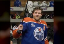 Oilers Crowbar Award: Draisaitl Adds New Postgame Prize Leon Draisaitl holds up the Oilers crowbar postgame award in the locker room after win over Wild
