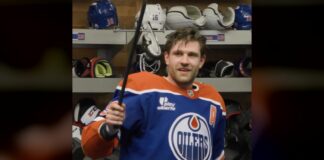 Oilers Crowbar Award: Draisaitl Adds New Postgame Prize Leon Draisaitl holds up the Oilers crowbar postgame award in the locker room after win over Wild