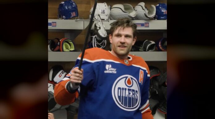 Oilers Crowbar Award: Draisaitl Adds New Postgame Prize Leon Draisaitl holds up the Oilers crowbar postgame award in the locker room after win over Wild