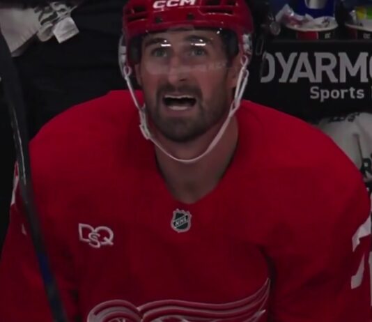 Dylan Larkin on the Detroit Red Wings bench after scoring in his season debut against the Ottawa Senators