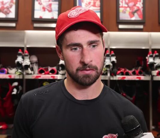 Dylan Larkin speaks to reporters in the Red Wings locker room after scoring in his season debut against the Ottawa Senators