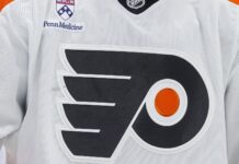 Nikita Grebenkin Injury: Flyers Winger Out Four Months Philadelphia Flyers white jersey logo as team announces Nikita Grebenkin back surgery
