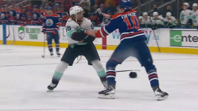 Trent Frederic fights Ryan Lindgren, Oilers vs Kraken Oilers forward Trent Frederic fights Kraken defenseman Ryan Lindgren at Rogers Place