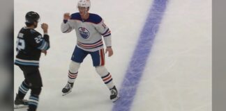 Trent Frederic Oilers and Jack McBain Mammoth square up with fists raised before first period fight