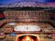 Heritage Classic Renderings: Winnipeg Stadium Becomes a Cabin Rendering of the 2026 Heritage Classic rink at Princess Auto Stadium in Winnipeg with a cabin theme and stone fireplace