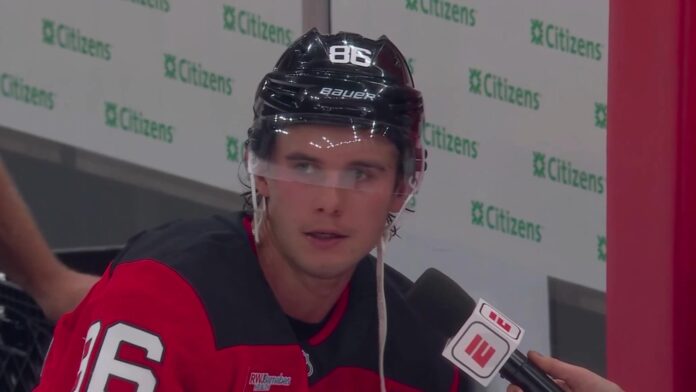 Jack Hughes ESPN intermission interview Jack Hughes of the New Jersey Devils during an ESPN intermission interview at the Devils home opener against the Flyers
