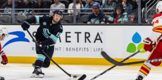 Jared McCann Injury: Kraken Forward Out 10 Weeks on IR Jared McCann Kraken forward shooting puck against Flames