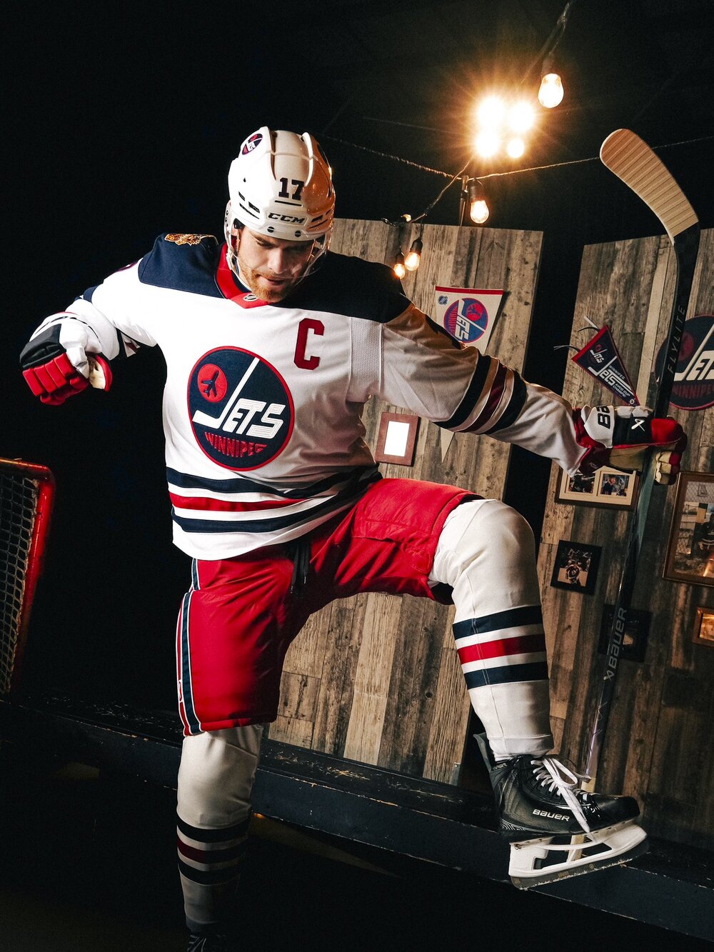 Jets captain Adam Lowry in the white 2026 Heritage Classic jersey
