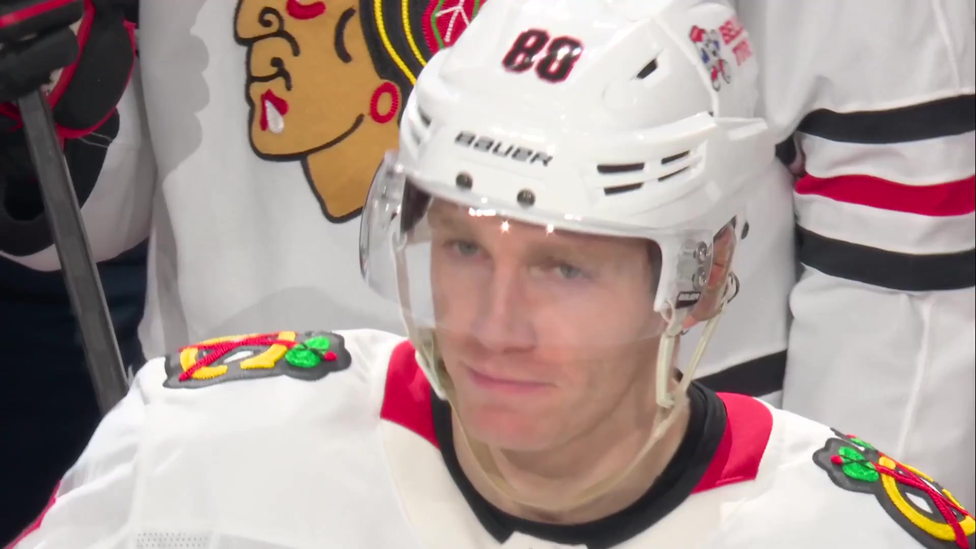 Patrick Kane in Blackhawks jersey reacts to standing ovation and video tribute in Detroit return