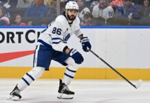 Marchenko Injury: Leafs Winger Week-to-Week After Hit Kirill Marchenko Maple Leafs winger skating in white road jersey