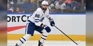Marchenko Injury: Leafs Winger Week-to-Week After Hit Kirill Marchenko Maple Leafs winger skating in white road jersey