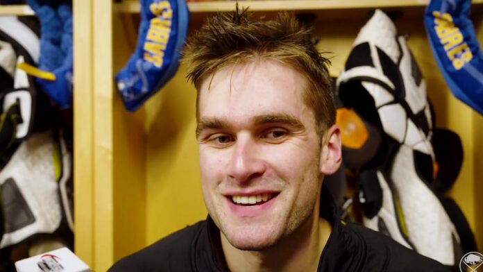 Buffalo Sabres defenseman Louis Crevier speaks to media in the locker room after signing a four-year contract extension