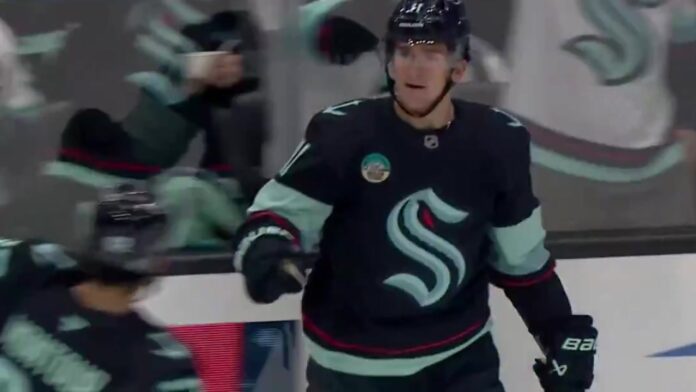 Mackie Samoskevich Kraken goal vs Flames Mackie Samoskevich celebrates his first goal with the Seattle Kraken against the Calgary Flames at Climate Pledge Arena