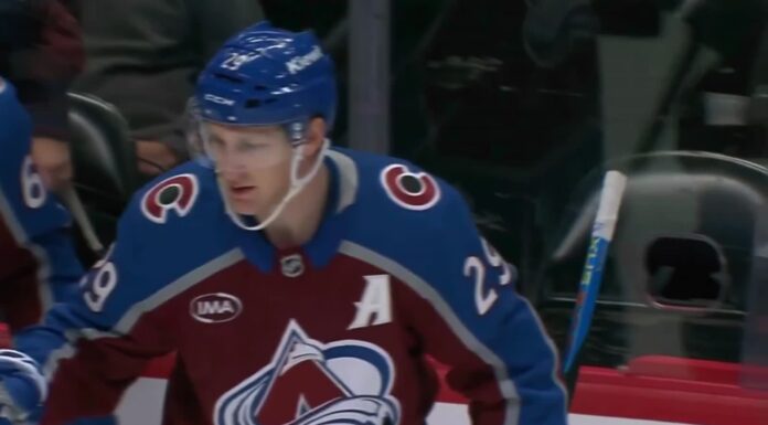 MacKinnon Four-Point Game: Avs Beat Lightning 6-3 Nathan MacKinnon of the Colorado Avalanche celebrates at the bench after a goal against the Tampa Bay Lightning