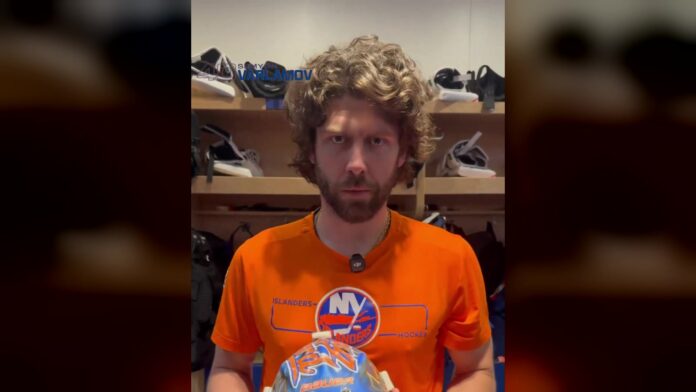 Semyon Varlamov Islanders mask first start 2026 Islanders goalie Semyon Varlamov holds his new 2026-27 mask in the dressing room before his first NHL start since 2024