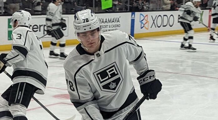 Kings Losing Streak: LA Is Now the NHL’s Only Winless Team Alex Laferriere handles the puck in warmups wearing a Los Angeles Kings white jersey