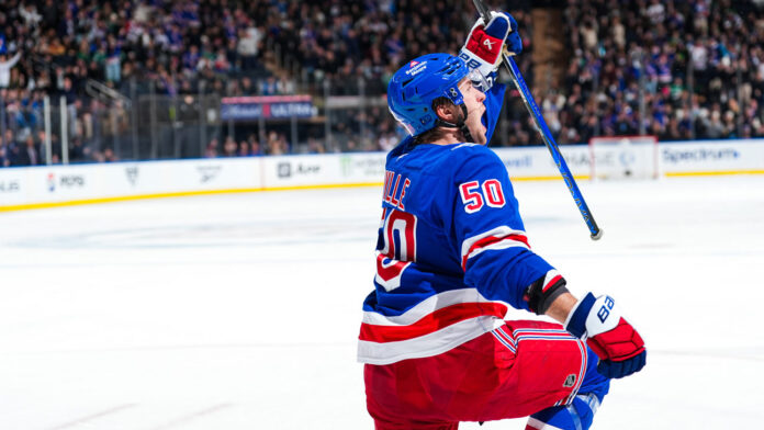 Will Cuylle celebrates a goal at Madison Square Garden Rangers forward Will Cuylle celebrates a goal in the home blue sweater at Madison Square Garden