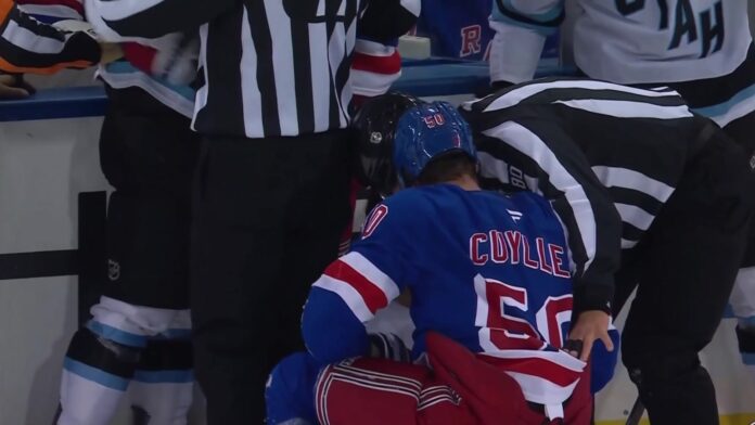 Will Cuylle Rangers Mammoth Rangers forward Will Cuylle (50) held by linesmen after his hit from behind on Mammoth forward Dylan Guenther at Madison Square Garden