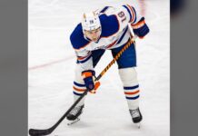 Zach Hyman Injury: Oilers Winger Set to Return Saturday Zach Hyman waits for a faceoff in a white Edmonton Oilers jersey