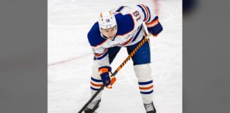 Zach Hyman Injury: Oilers Winger Set to Return Saturday Zach Hyman waits for a faceoff in a white Edmonton Oilers jersey